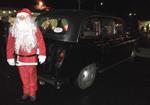 Arrivée du Père Noël à Hesloup à bord de notre Taxi anglais.